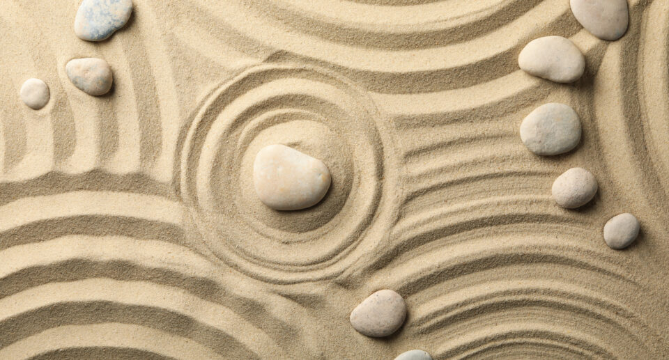 Stones on the sand with patterns. Zen concept